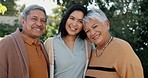 Nature, face and woman with her senior parents in a garden for family bonding together. Smile, care and portrait of female person hugging elderly man and woman in retirement with love in outdoor park