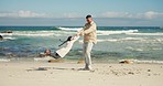 Happy, father and swing child on beach, nature or outdoor on holiday, vacation and bonding together with game. Playing, dad and girl with support in air, flying or happiness at ocean or sea in Brazil