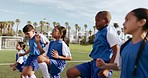 Children, cardio and sport on soccer field with leg warm up for training and school fitness. Youth, kids and workout for competition in uniform with girl and athlete group with students and exercise