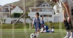 Sports coach applause, soccer ball and child shooting practice for competition, target aim or youth development workout. Football player goal, support praise and kid athlete training on grass pitch