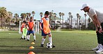 Soccer, boy fitness and training for game and sport drill for workout and exercise on a school field. Students, coaching and children with teamwork, player and team with youth and athlete group