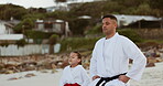 Beach, teaching karate or child learning martial arts, fighting or mindfulness in fitness coaching. Breathing, tai chi or teacher with a kid, girl or student in workout, exercise or training at sea