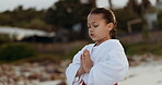 Karate, meditation and girl breathing on the beach for fitness, mental health or wellness while training. Exercise, children and self defense with a young kid outdoor on the coast for a fight workout