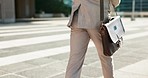 City, walking legs or business person, lawyer or advocate on outdoor urban journey to office building, law firm or job. Briefcase bag, morning or back of attorney on morning travel to work in Chicago