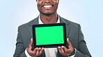 Black man, tablet and green screen, presentation for business ads and digital information on blue background. Tracking marker, communication and technology promo, UX design and marketing in studio