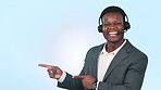 Call center, black man and laughing face with pointing to contact us promotion in studio. Blue background, male professional and business portrait with deal, smile and advice for telemarketing