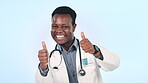 Man, doctor and thumbs up, healthcare success or celebration, thank you and like emoji on a blue background. Happy face of african worker in yes, okay and good job emoji for medical service in studio