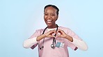 Doctor, woman and heart sign at studio with point at you, recruitment and emoji for face by blue background. Nurse, medic or icon for love, care or kindness for decision, choice or vote with feedback