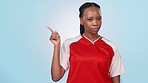 Pointing, face and black woman on a studio background for soccer fail, mistake or disapproval. Stop, portrait and an African athlete, coach or football player with a hand gesture on mockup for a game