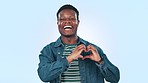 Black man, heart and hands with portrait and love, expression and emoji with support on blue background. Choice, charity or donation with health, happy with care sign and laughing in a studio