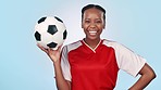 Happy, face and a black woman for soccer, game or ready for a competition on a blue background. Laughing, sports and portrait of a young female football coach or player for exercise or training