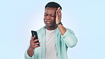 Phone, stress and black man in studio with cybersecurity problem, mistake or crisis on blue background. Smartphone, fail and African male model frustrated by glitch, phishing or social media hacker