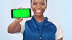 Black woman, phone and green screen for sports app or advertising against a studio background. Portrait of happy African female person or athlete showing mobile smartphone display or mockup space