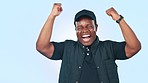 Celebration, excited and black man in a studio with fist pump for winning, success and achievement. Cheer, happy and young African male model screaming for competition winner by white background.