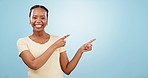 Woman, face and advertising choice in studio for information, sales deal and offer on blue background. Happy portrait, african model and pointing to mockup, feedback and announcement of news about us