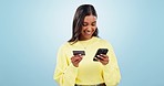 Smile, phone or woman in studio with credit card for a financial investment on digital fintech. Mobile app, ecommerce payment or happy girl typing banking data for online shopping on blue background