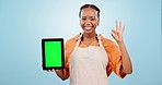 Tablet mockup, green screen and black woman barista with advertising, OK with app and point at ads on blue background. Tracking marker, social media promo or agreement, marketing for cafe in studio