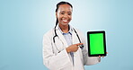Doctor, woman and tablet green screen for healthcare presentation, website or registration in studio. Face of african person with medical, digital mockup and telehealth service on a blue background