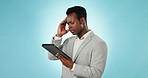 Tablet, stress and headache with a business black man in studio on a blue background for problem solving. Technology, compliance or 404 error with a corporate employee looking at a network issue