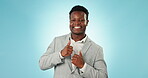 Thumbs up, dance and success with a business black man in studio on a blue background for celebration. Portrait, smile and a happy young corporate employee in a suit cheering a win, deal or bonus