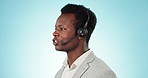 Man, face and call center communication in studio for customer service, FAQ advisory and IT questions on blue background. African telemarketing agent, virtual assistant and microphone for CRM contact