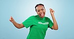 Woman, happy and dancing in studio on blue background with mockup for social media, volunteering or campaign. African, person or girl with smile in happiness for community service, donation or vote
