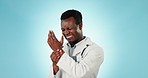 Black man, doctor and wrist pain from injury, arthritis or carpal tunnel syndrome against a blue studio background. African male person, medical or surgeon with sore hand, ache or joint on mockup