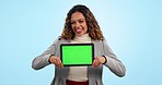 Face, business woman and green screen on tablet for advertising space, sign up offer or tracking markers in studio. Portrait, happy worker and laugh with digital mockup information on blue background