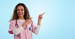 Mockup, happy woman or doctor pointing in studio for advice on healthcare, health insurance or offer. Smile, portrait and nurse with review, feedback or medical information guide on blue background.