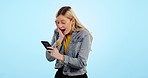 Wow, woman and phone with excited face for winning online prize, deal or competition in studio on blue background. Celebration, person and smartphone with success for promotion, reward or bonus 