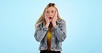 Face, surprise and woman with wow, announcement and gossip on a blue studio background. Portrait, person and model shocked, emoji and icon with expression, emotions and omg with mockup space or smile