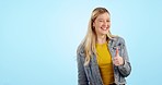 Thumbs up, pointing and woman with hand to choice, decision or presentation on blue background in studio. Happy, smile and girl with success, agreement and promotion of information in mockup space