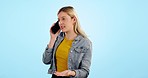 Conversation, phone call and woman with connection, speaking and discussion on a blue studio background. Person, girl or model with a smartphone, network and digital app with chat, emotion or talking