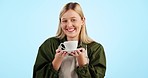 Portrait, worker and woman with cup in studio on blue background with mockup for social media. Female, barista or employee with smile, happiness and joy for online, announcement or sale of beverage