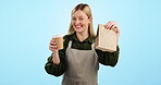 Waitress, woman and coffee takeaway with bag in studio for marketing or advertising service, delivery and order option with smile. Portrait, person and employee for business with cafe or bakery deal