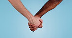 People holding hands, diversity and solidarity with partner, help and support with love and relationship on blue background, Together, wellness and community, care and bonding with kindness in studio