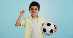 Winner, soccer ball or face of child in studio with smile, joy or happiness for sports success, score or goal. Happy boy, portrait or excited kid with fist or football on blue background mockup space