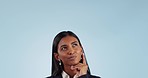 Business woman, thinking and looking up in studio with mockup space for promotion by blue background. Entrepreneur, ideas and brainstorming for decision, choice or remember plan with confused face