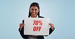 Discount price sign, woman and wow face from shopping deal, promotion and poster in studio. Happy, portrait and smile with sale announcement promo on paper for advertising with blue background