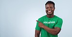 Studio volunteer, happy black man or point at community service info, nonprofit promo and charity support notification. Recycle, climate help or activist portrait, offer or project on blue background