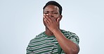 Hands, yawn and face of tired man in studio with burnout, low energy or exhausted on blue background. Fatigue, portrait and African male model with yawning emoji for sleepy, lazy or bored gesture