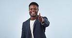 Happy black man, business and thumbs up in success, winning or good job against a studio background. Portrait of African businessman smile with like emoji, yes sign or OK for thank you or approval