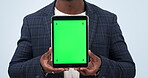 Businessman, hands and tablet with green screen in advertising or marketing against a studio background. Closeup of man or employee showing technology display, app or mockup with tracking markers