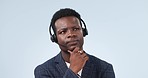 Black man, face and thinking in call center for customer service or telemarketing against a studio background. African male person, consultant or agent in wonder or contemplation for ideas on mockup