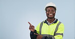 Engineer, pointing to space and man advertising in studio isolated on a blue background mockup. Portrait, hand and happy African architect marketing construction, building promotion and commercial