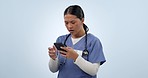 Phone, shocked and woman nurse frustrated with 404 error, stress and isolated in studio blue background for mistake. Smartphone, healthcare and angry worker annoyed by mistake, problem and glitch