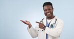 Palm, pointing and black man or doctor with information, advice or communication about healthcare. Happy, show and face portrait of African surgeon with a gesture on a studio background for nursing