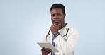 Thinking, black man or doctor in studio with tablet, research ideas and brainstorming for healthcare. Problem solving, decision and medical professional on blue background mockup with digital app.