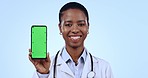 Phone, green screen and face of woman doctor in studio with mockup for advertising or marketing. Tracking markers, mock up and African healthcare worker with cellphone chroma key by blue background.