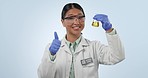 Studio, woman or scientist with glass, thumbs up and lab test in chemistry, biotech or medical research. Chemical study, vaccine development success and science, doctor with liquid on blue background